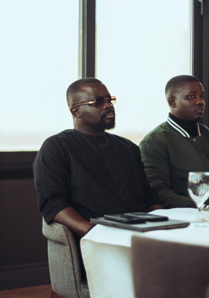Two men sitting at a table indoors