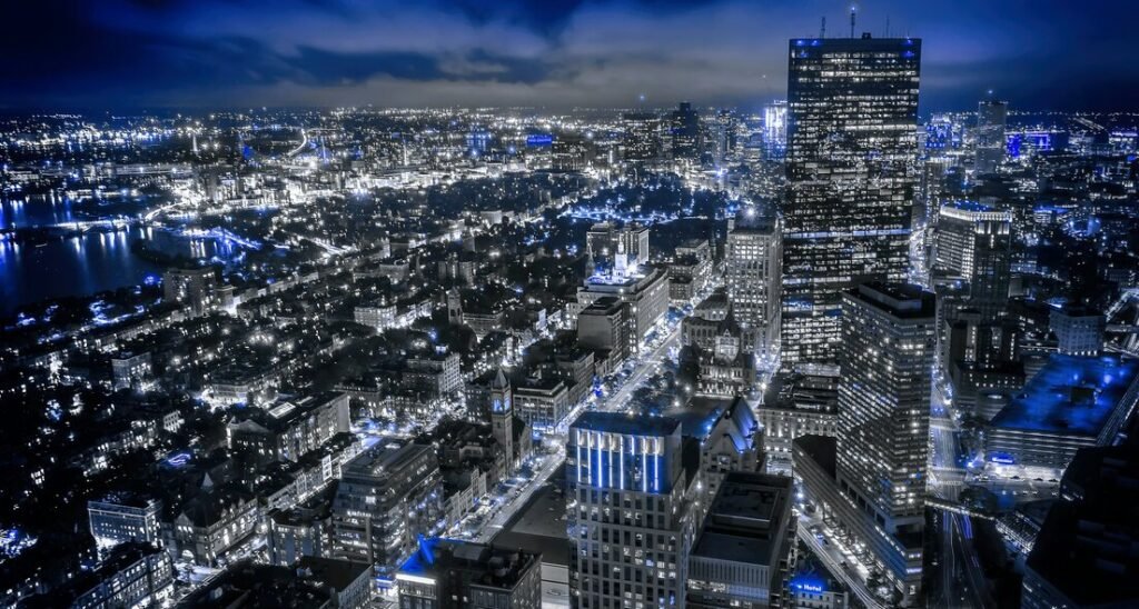 City skyline at night with illuminated skyscrapers