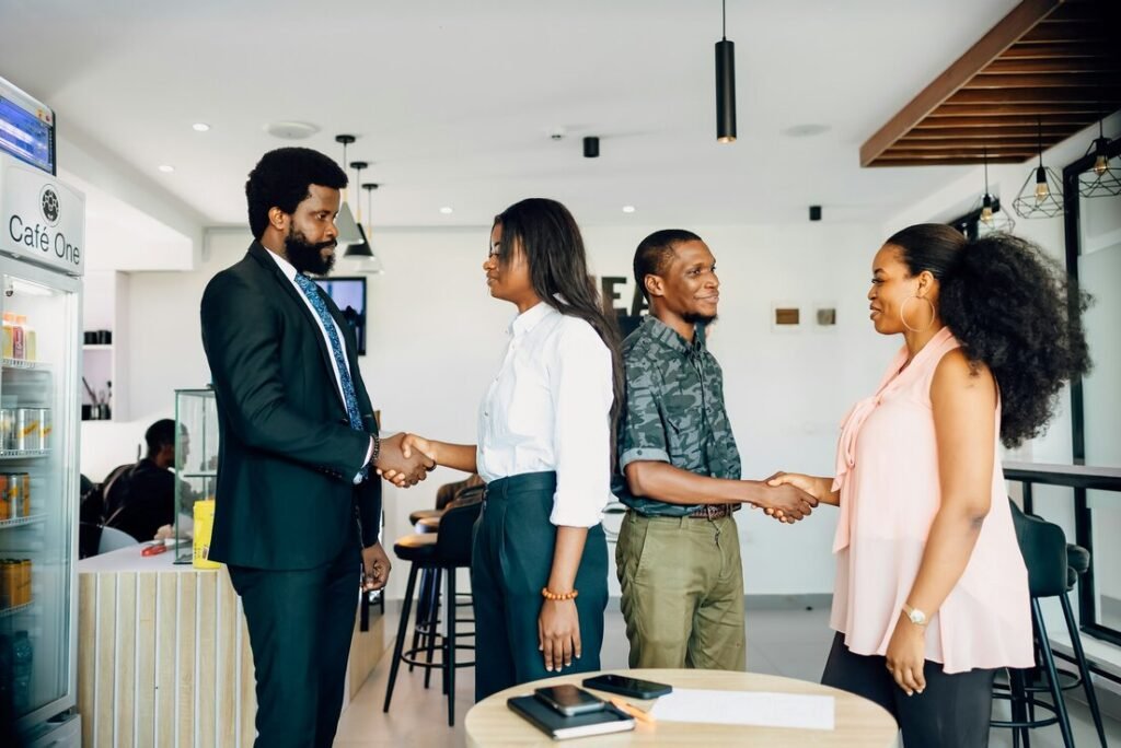 Business people shaking hands in a bright office
