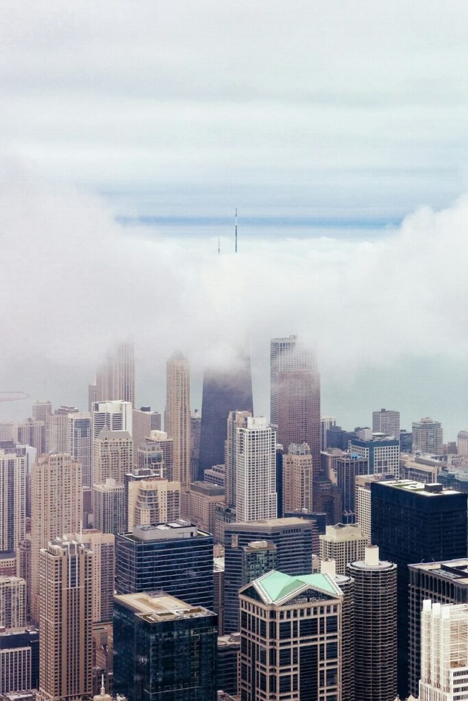 Skyscrapers under cloudy sky