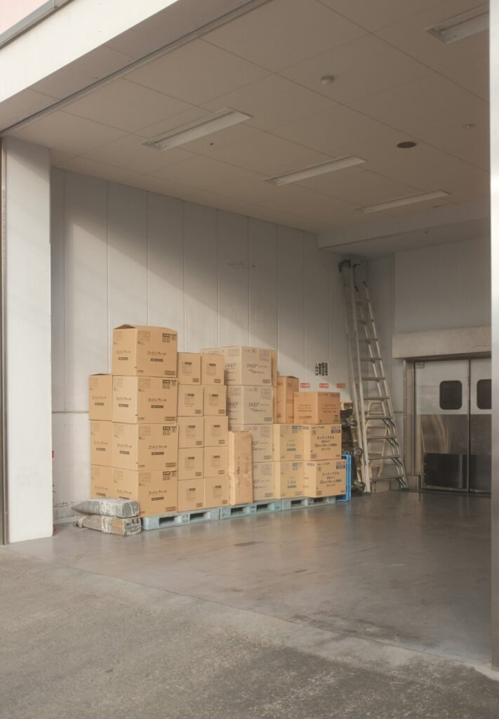 Brown cardboard boxes on white floor tiles