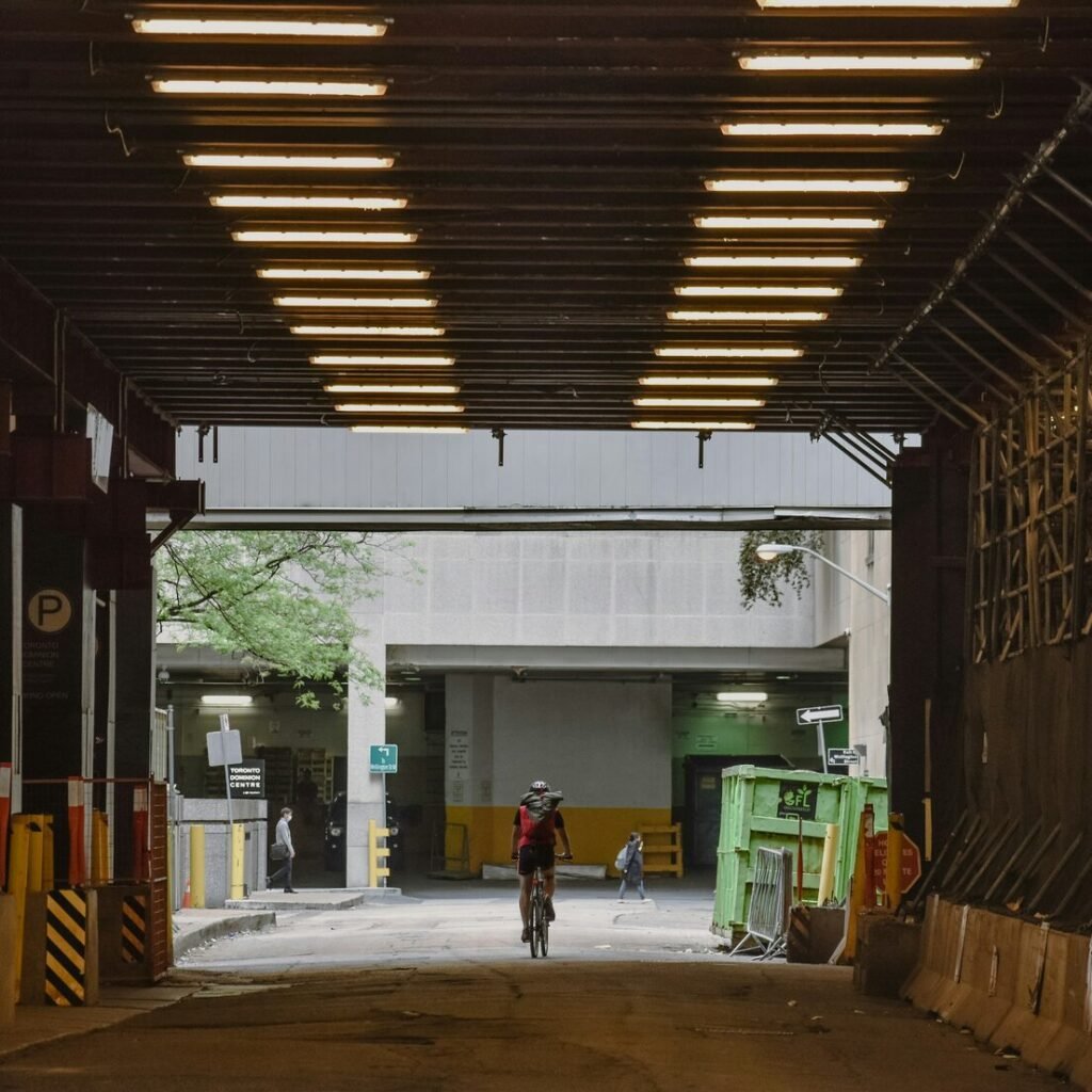 A person riding a bike in a warehouse