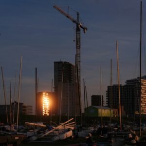 A harbor filled with lots of boats and tall buildings