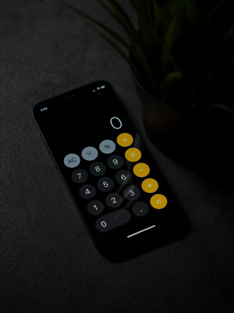 Black remote control on gray textile