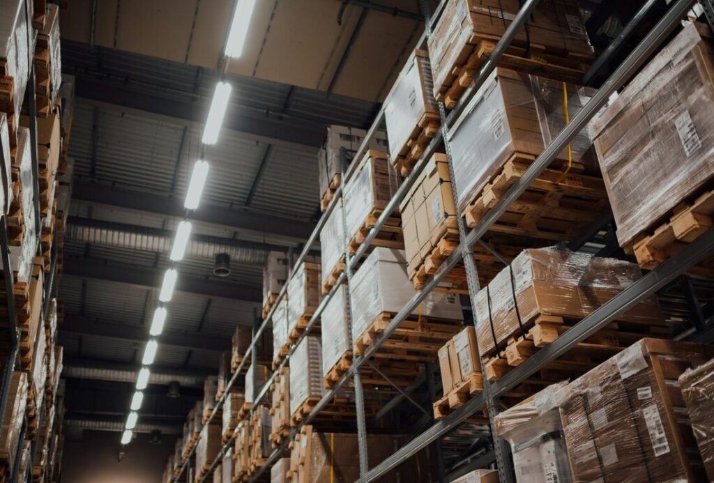 Brown cardboard boxes on white metal rack