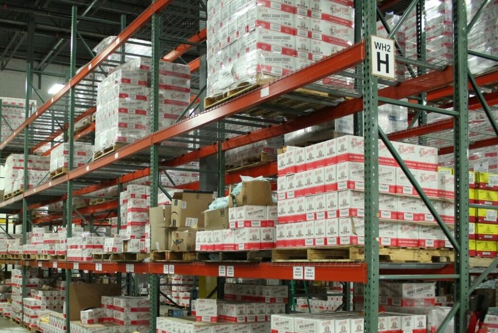 White and red cardboard boxes on shelf