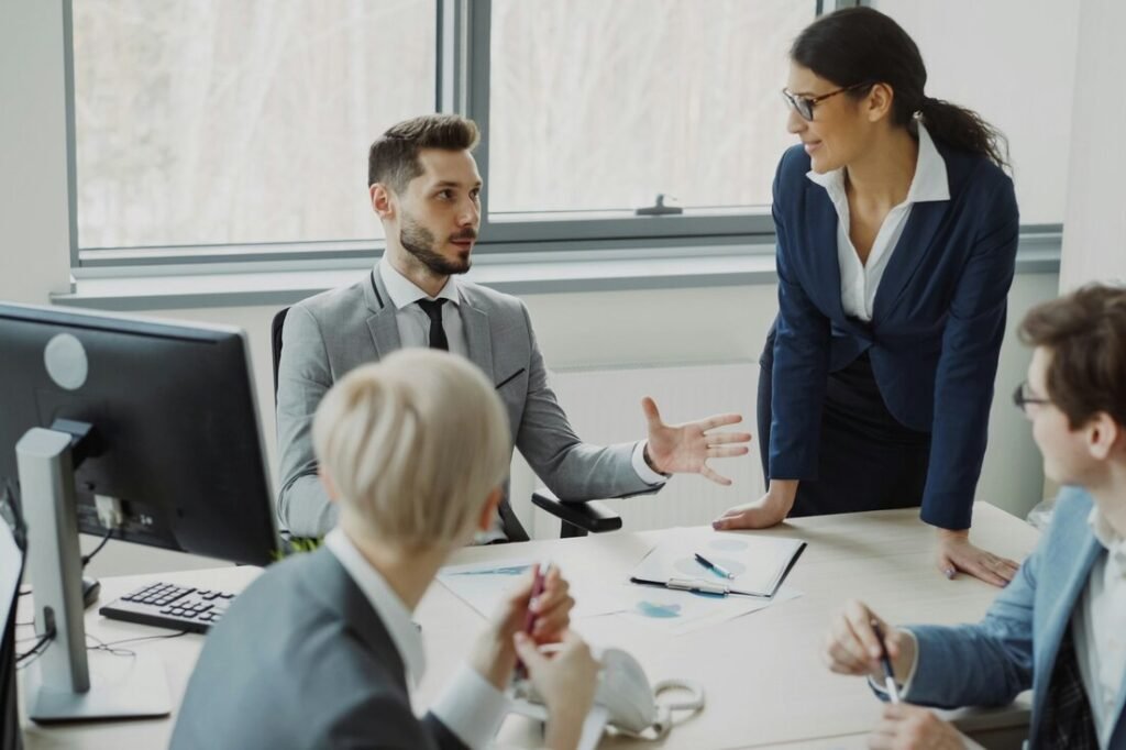 Business professionals collaborating in a modern office meeting