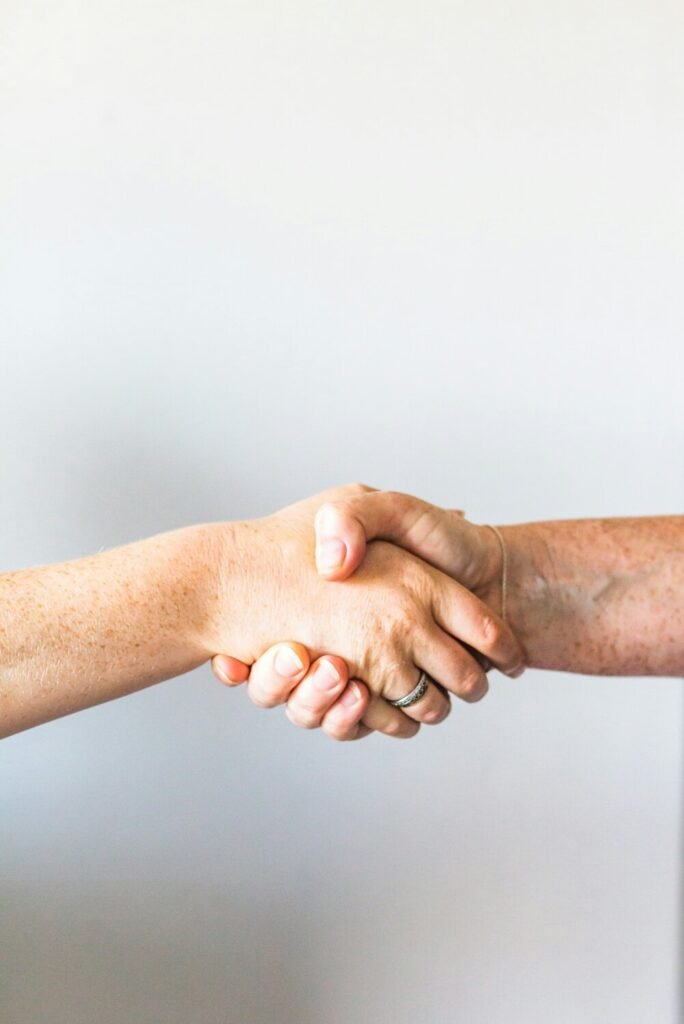 Person holding hands of another person