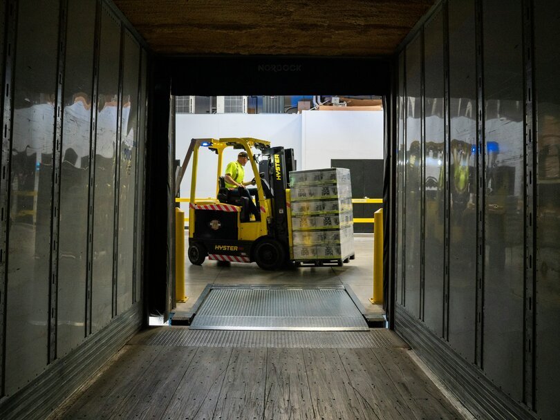 Man carrying box using fork liftr