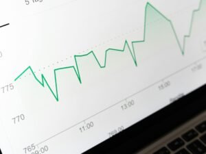 Stock market chart displayed on laptop screen