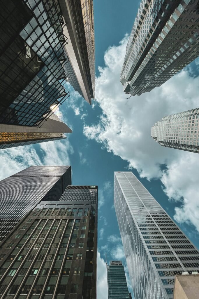 Low angle photography of high rise buildings under blue sky during daytime