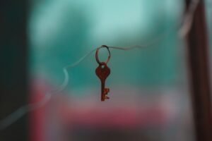 Brown key chain with black and red background