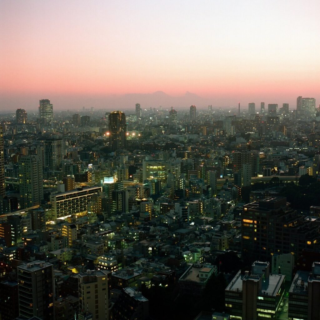 Cityscape with glowing lights at dusk