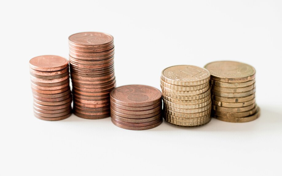 Stacks of coins on a white background