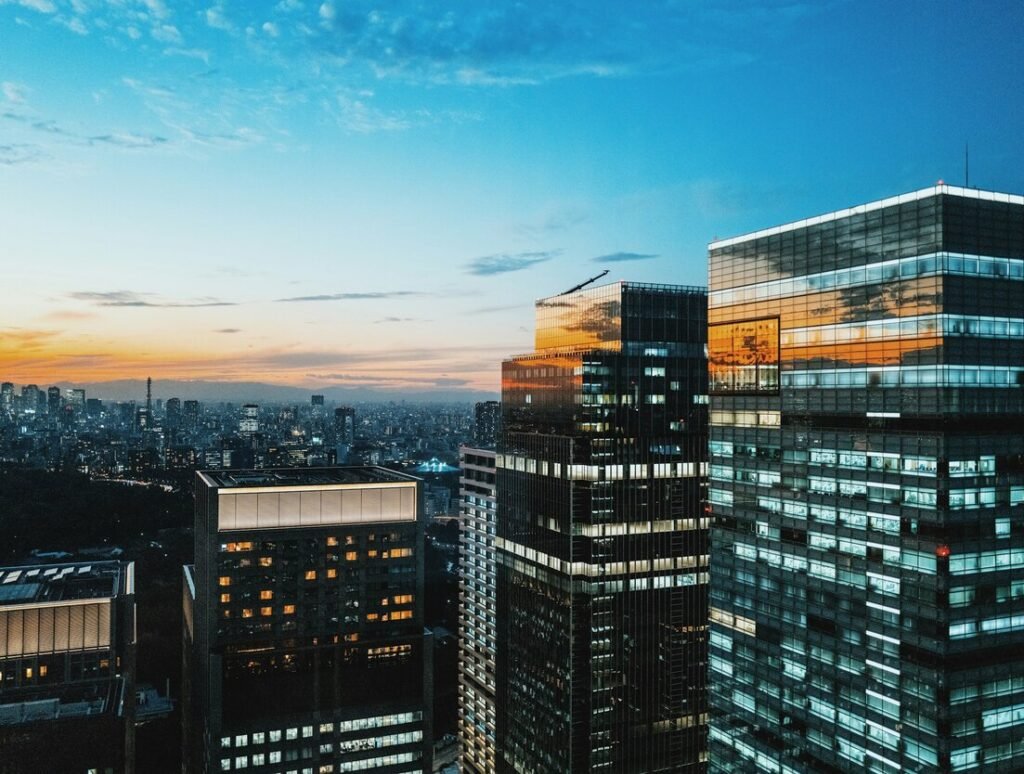 Birds-eye view of cityscape under blue sky