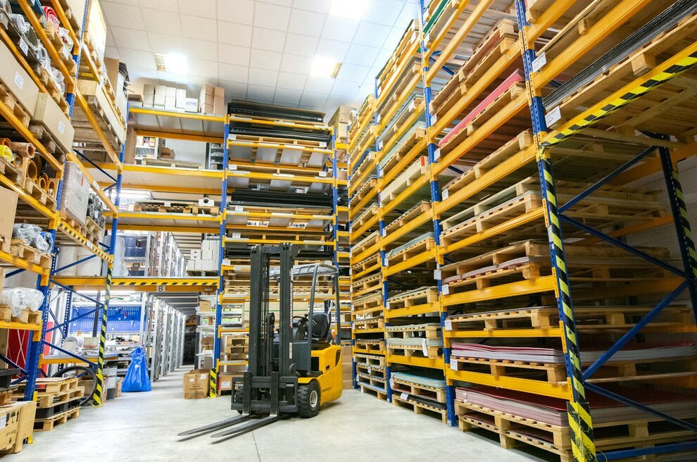 A large warehouse filled with lots of pallets