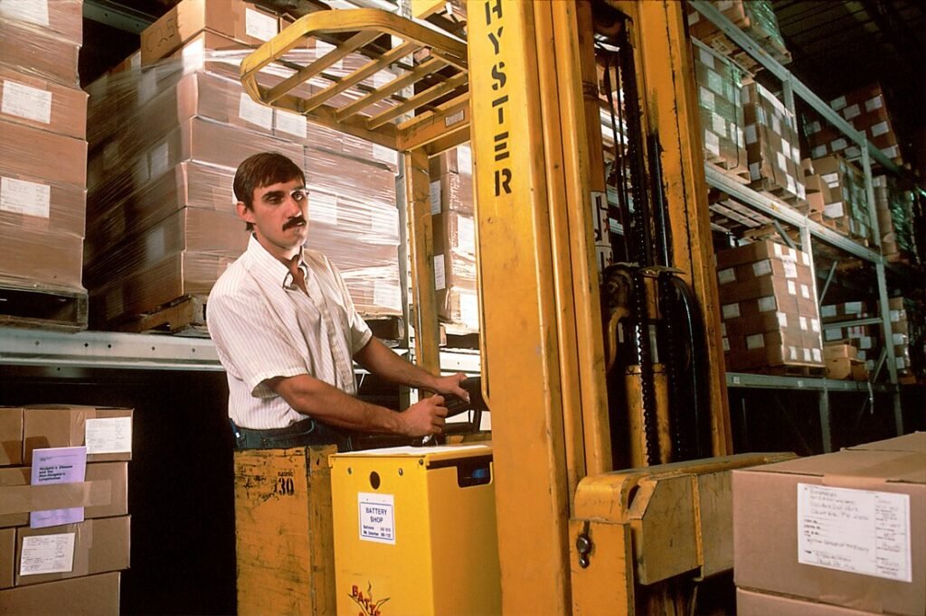 Yellow driving forklift