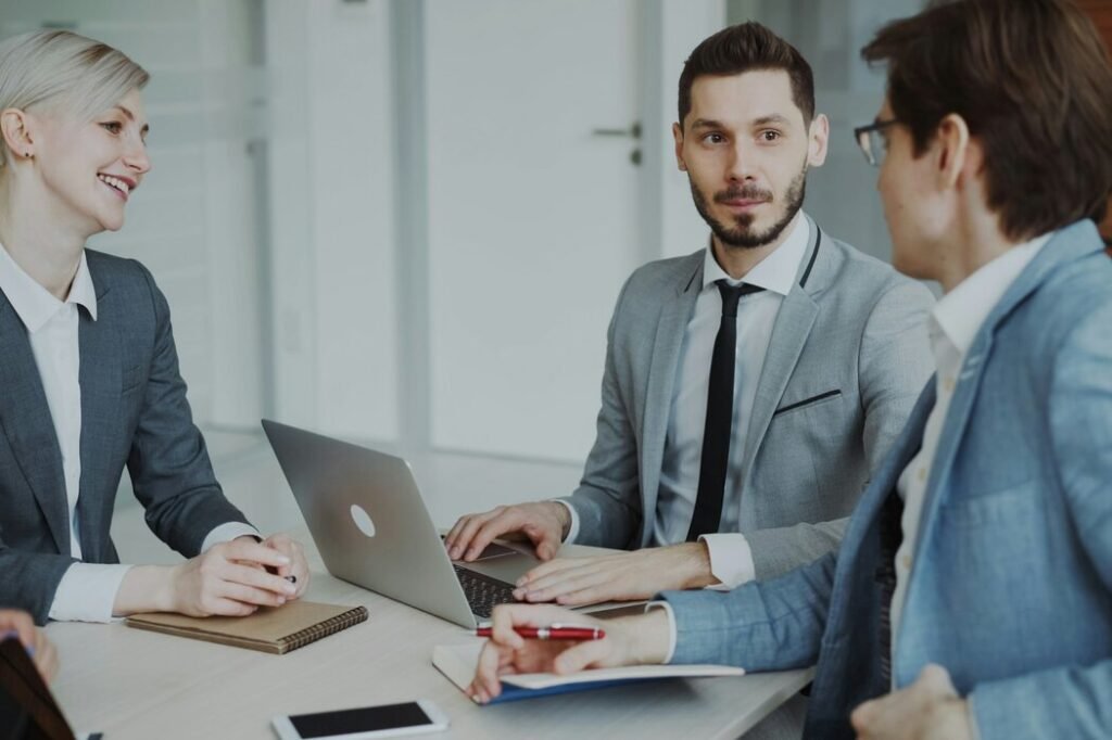 Business professionals in a meeting around a table