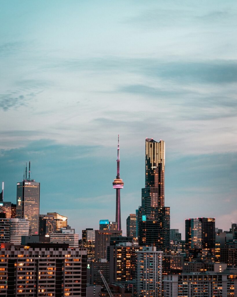 City skyline under gray cloudy sky during daytime