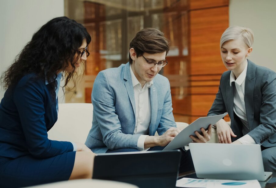 Three business people collaborating on a project