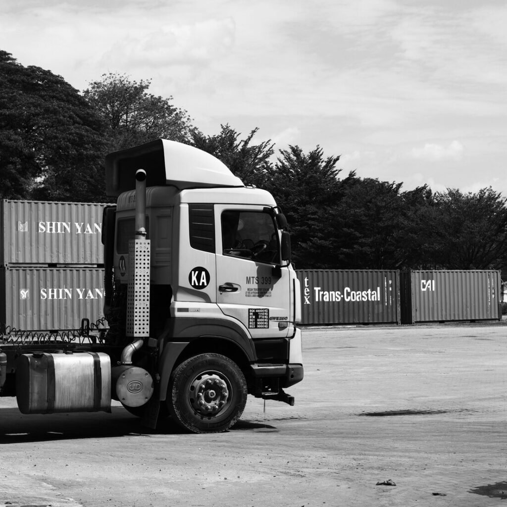 A truck parked in a container yard