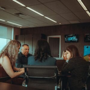 A group of people sitting around a table