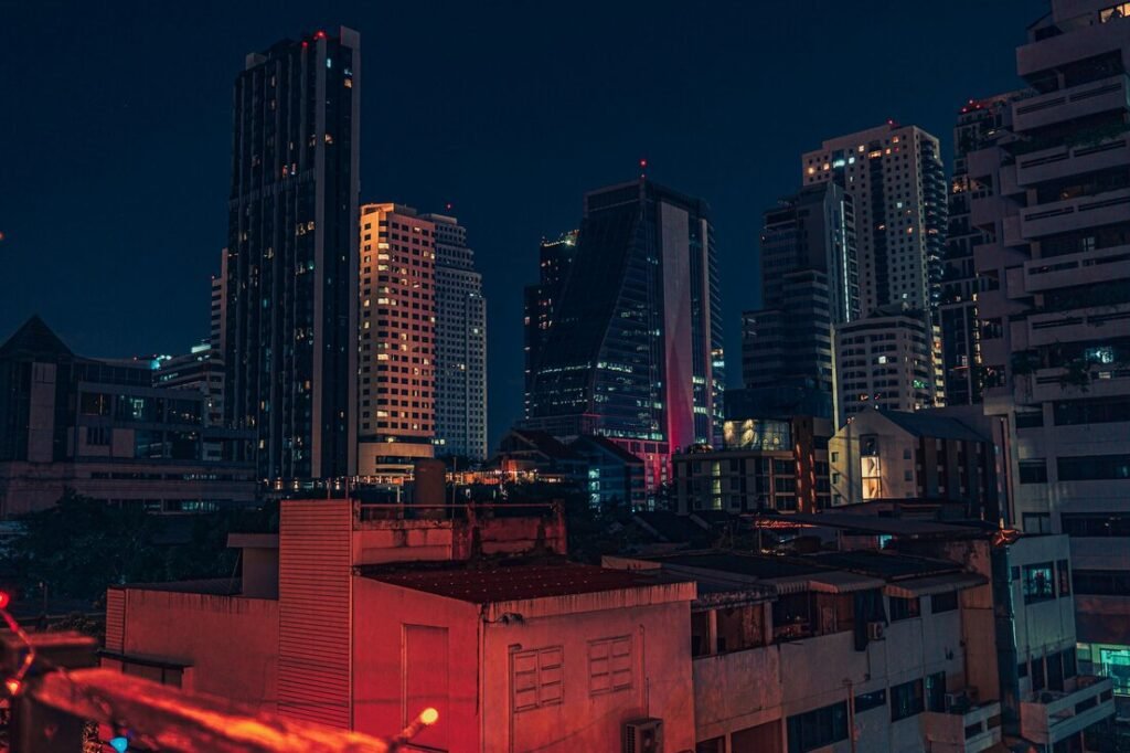 A view of a city at night from a rooftop