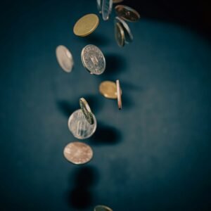 A bunch of coins falling off of a table