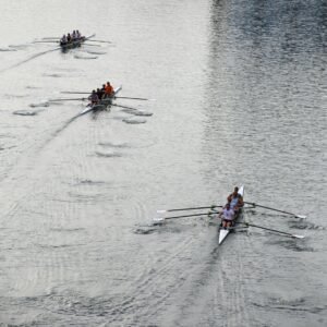 A group of people rowing on a body of water