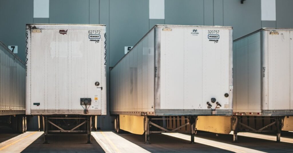A row of semi trucks parked next to each other