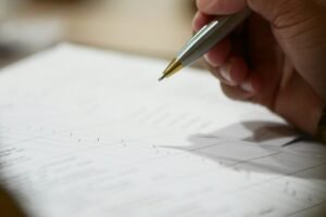 A hand holding a pen