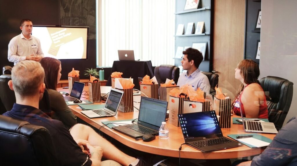 Business team meeting around a large table in an office