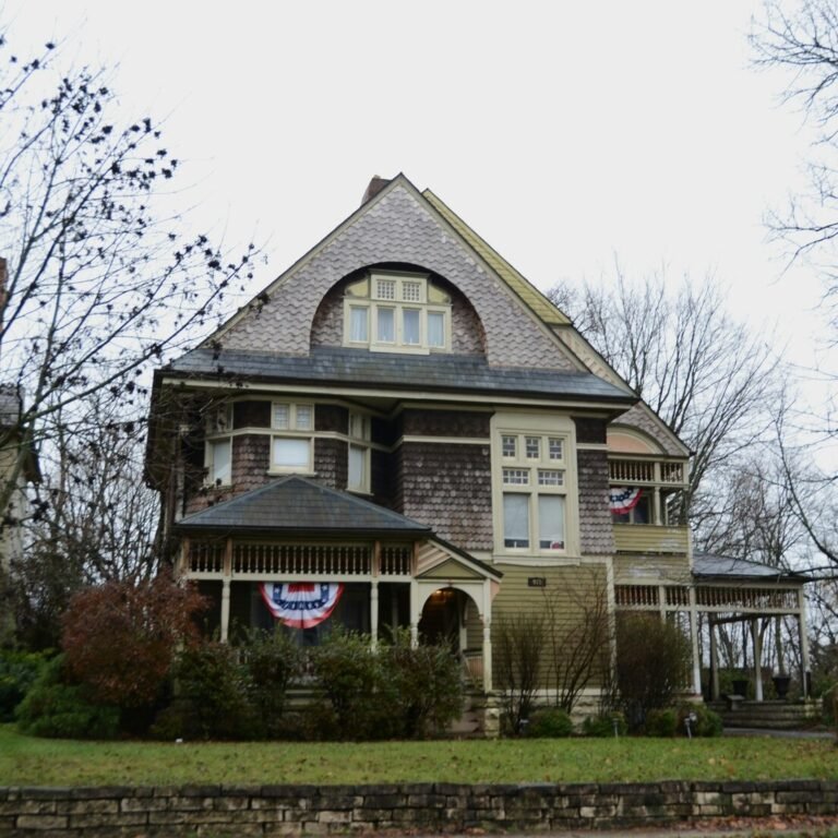 A large house with a flag on the front of it