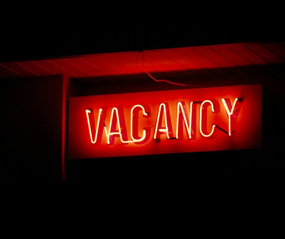 Red neon vacancy sign glowing at night