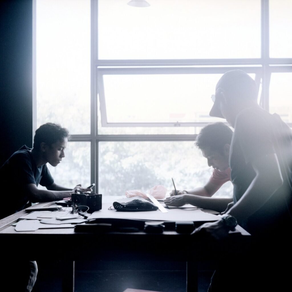 Unknown persons sitting indoors