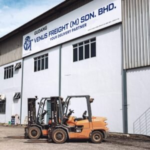 A forklift parked in front of a building