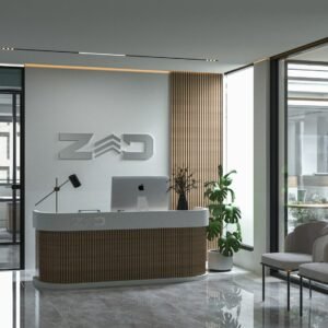 A reception desk with a laptop on top of it