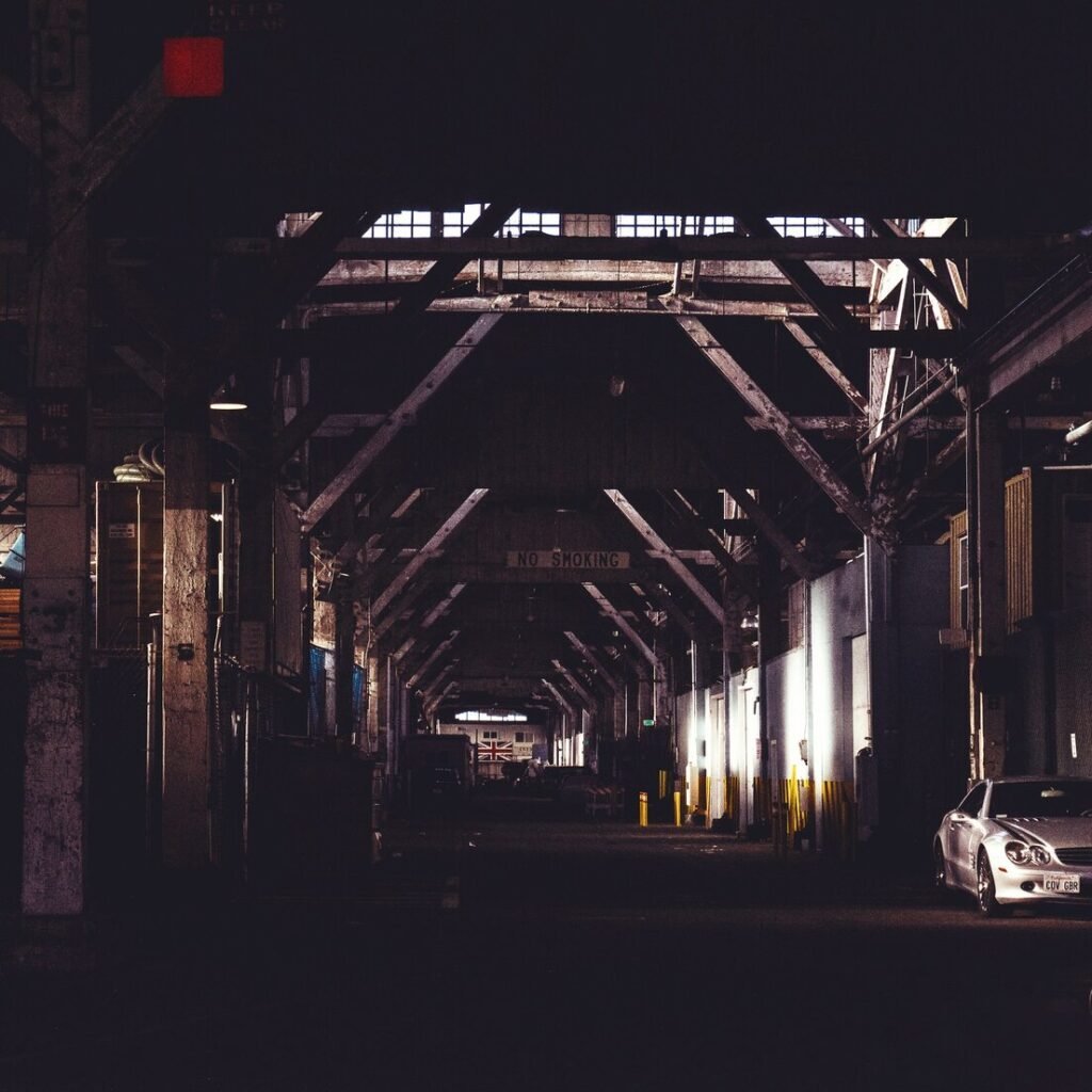 White sedan inside warehouse