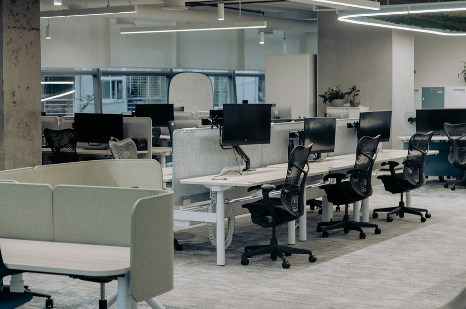 An office with a lot of desks and chairs