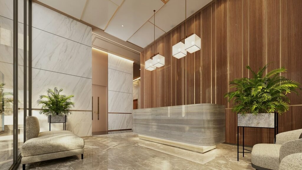Modern lobby with marble reception desk and plants