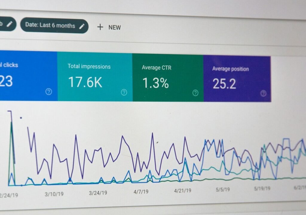 Laptop screen showing website analytics charts and statistics
