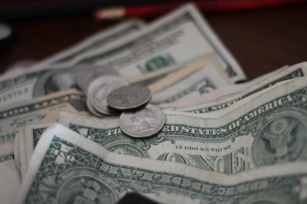 Photo of dollar coins and banknotes