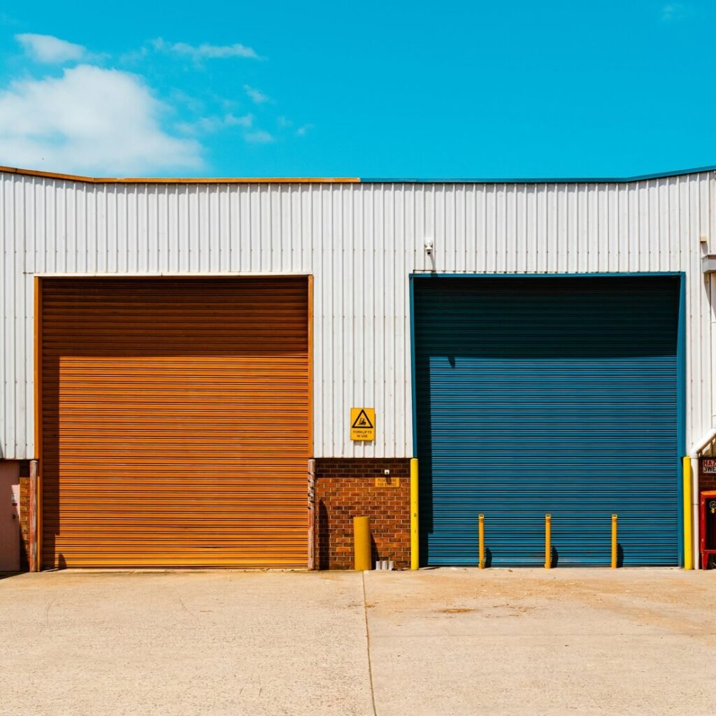 A couple of garage doors sitting next to each other